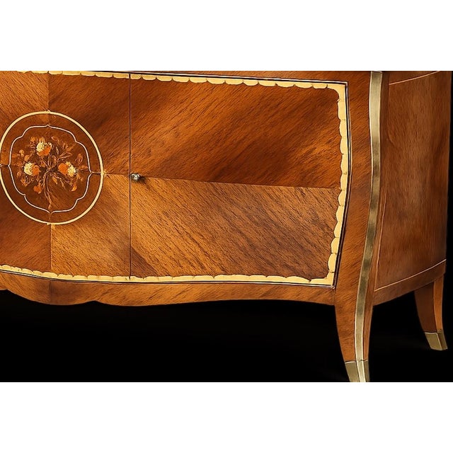 A striking French Art Deco buffet in the style of Gaston Poisson designs. This exceptional sideboard showcases the refined...