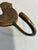 A charming vintage brass rooster with detailed feather etching, a proud ridged comb, and a single hook below. A keyhole...