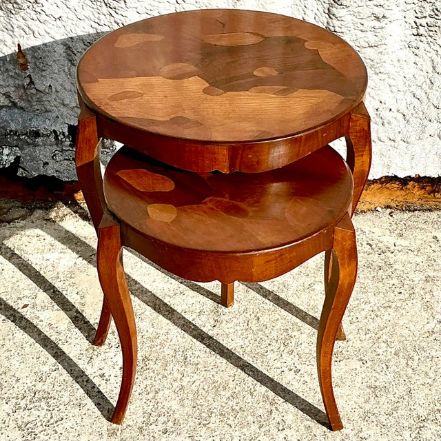 "Add a touch of classic sophistication to your space with this vintage Regency burl wood nesting table set. Featuring...