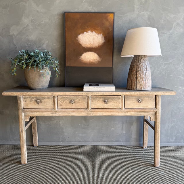 This charming vintage elm wood console is a one-of-a-kind piece with beautiful age and patina that adds character to any...