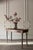 This exceptional late-19th-century primitive console table masterfully balances raw history with modern structural...