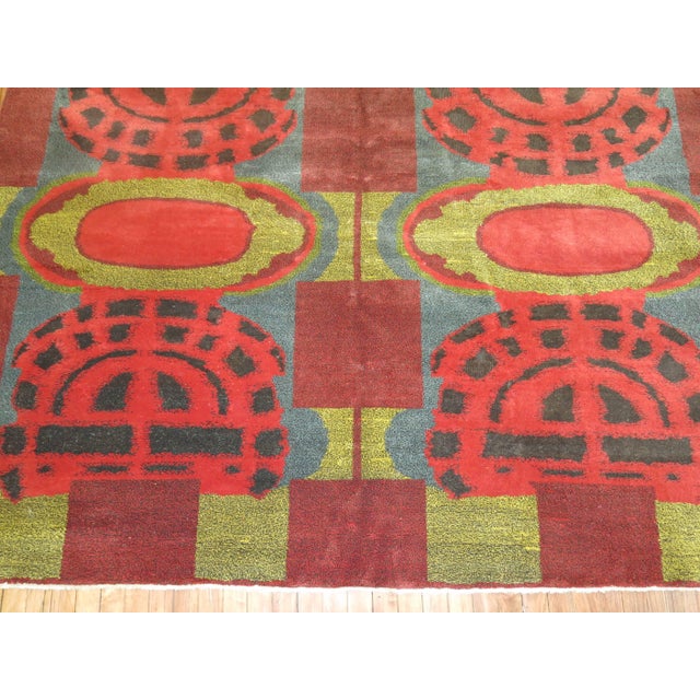 A dazzling European modernist carpet with intense colors and an abstract design. 7' x 9'10''