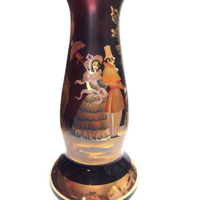 Measures approximately 17.5 inches tall X 8 inches wide at the bottom. The top of the vase measures 6 inches across....
