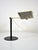 This adjustable desk lamp was produced by Waldmann Leuchten in the 1970s. It works with neon light bulbs and has a maximum...