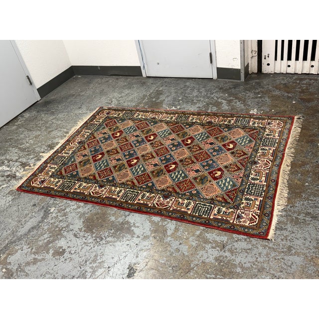 Design Plus Gallery presents a 4ft 7in × 6ft 10in Persian Bakhtiari-Style Kheshti Garden Panel Wool Rug. This wool rug...