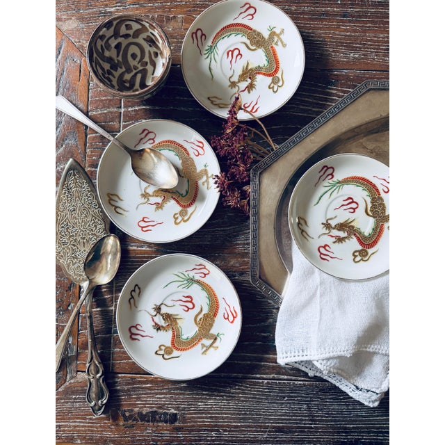 Striking set of four vintage Japanese Dragonware porcelain saucers featuring the wonderfully dramatic raised decoration...