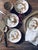 Striking set of four vintage Japanese Dragonware porcelain saucers featuring the wonderfully dramatic raised decoration...