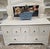 Solid wood apothecary coffee table, handpainted. It was a dark wood, but needed TLC and to be updated. I am not sure of...