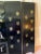 Chinese Black Lacquer and Carved Inlaid Hard Stone Four Panel Screen. Figures in a Landscape. Gilded Painted Flowers on the Back. Scholars Rock. For Sale - Image 12 of 12