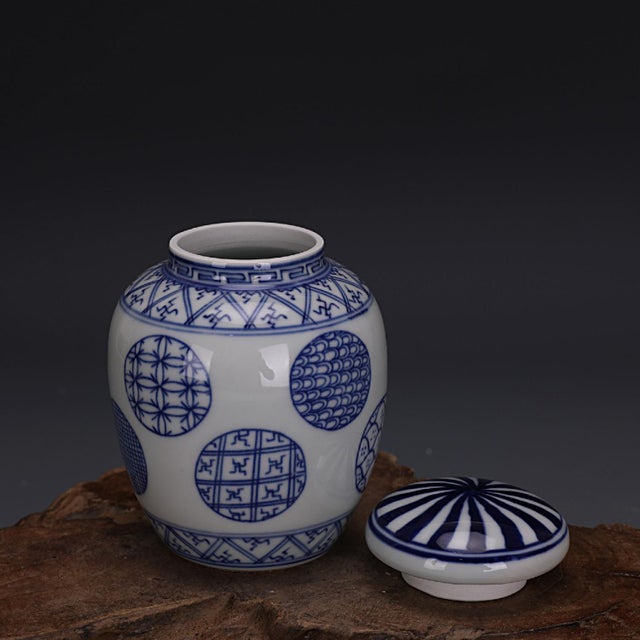 Charming Chinese porcelain lidded jar decorated in classic cobalt blue on crisp white glaze. The rounded body features...