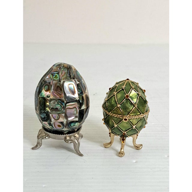 A refined pair of vintage decorative eggs, each with its own unique artistry and display presence. This two‑piece...