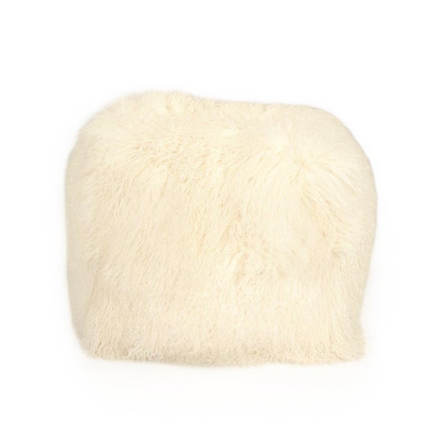 The 24" x 24" Tibetan Ivory Lamb Fur Pouf from Zentique is a luxurious floor pouf covered in plush ivory Tibetan lamb fur....