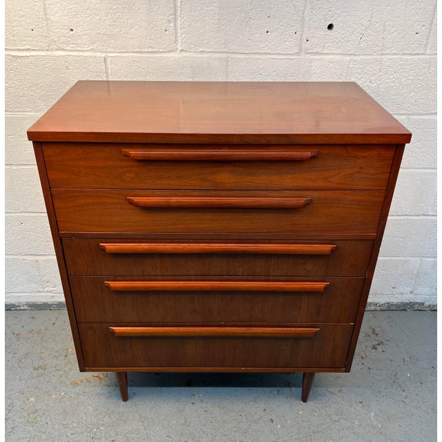 Add timeless mid-century style and practical storage to your home with this vintage five-drawer walnut highboy dresser by...