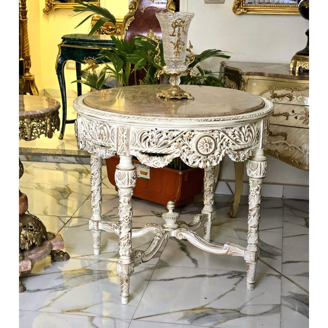Make a grand statement in your dining room with this breathtaking Grand Round Dining Table, masterfully crafted from...
