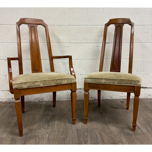 This is an elegant pair of vintage Mid Century Modern or Regency / Neoclassical style dining chairs featuring tall open...