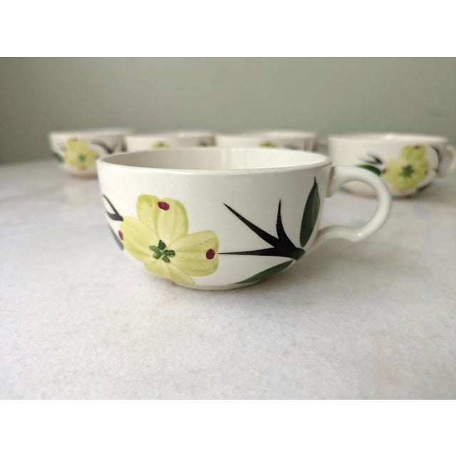 A set of vintage Dixie Dogwood pattern hand-painted teacups from Blue Ridge Southern Pottery.
