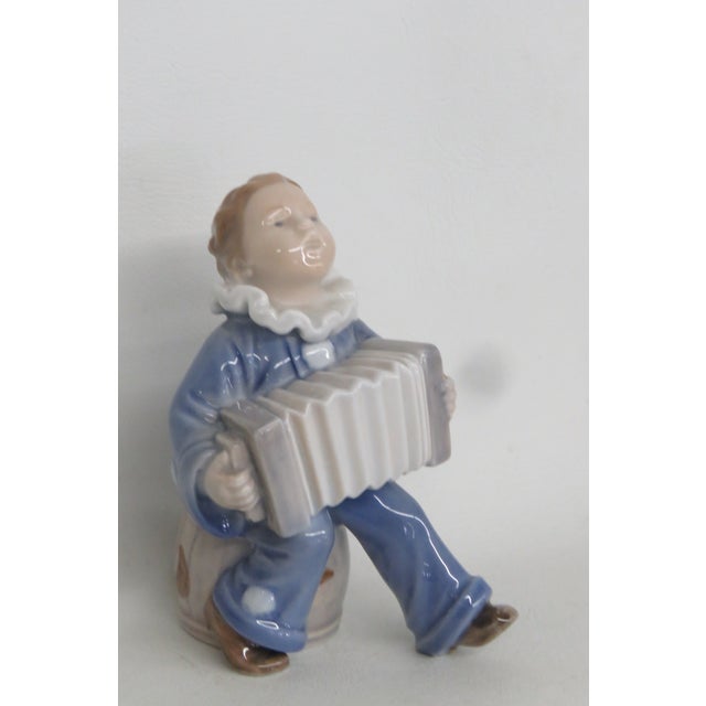 This charming Figurine is made of porcelain. This adorable piece is stamped as being made by Royal Copenhagen in Denmark,...