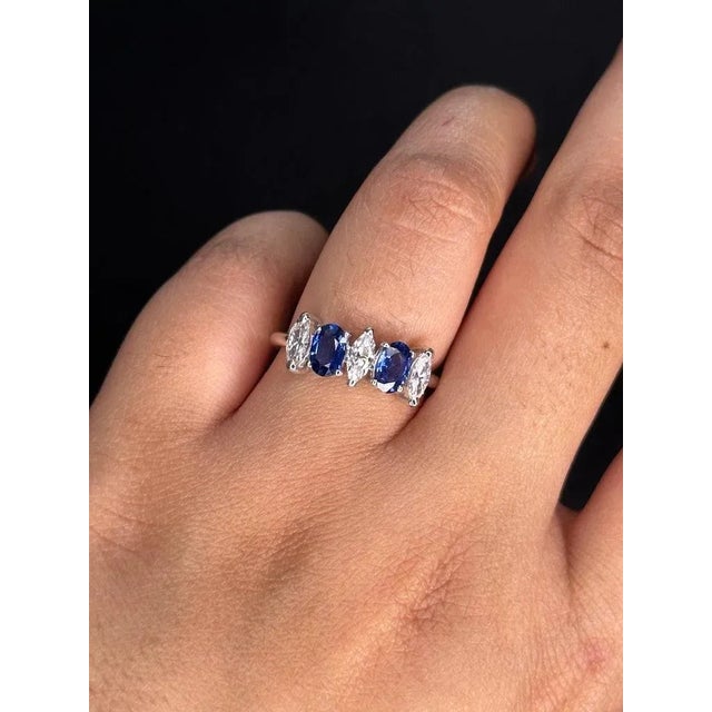 Stunning Diamond Blue Sapphire Engagement Ring in 18K Gold featuring natural sapphire of 1.16 carats and diamonds of 0.64...