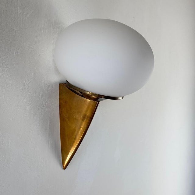 Refined and sculptural, this striking wall sconce — informally referred to as “lancia” for its resemblance to a wall-...