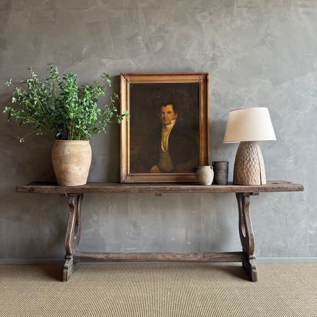 Antique Timber Console, with trestle style base. A dark rustic wood, with original metal ties Very solid and sturdy. Size:...