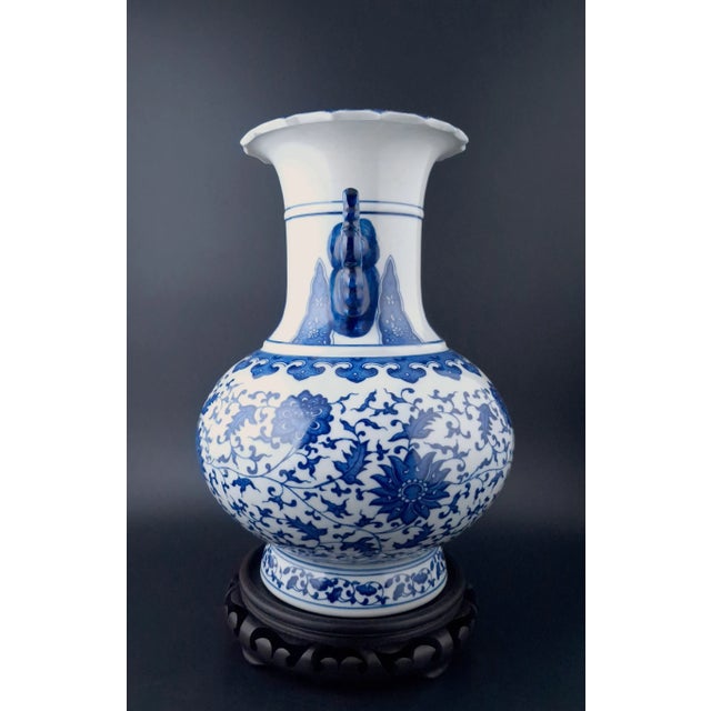 Chinese porcelain lotus flower haitangzun, a finely formed, begonia shape vase with a blue and white glazed exterior, and...