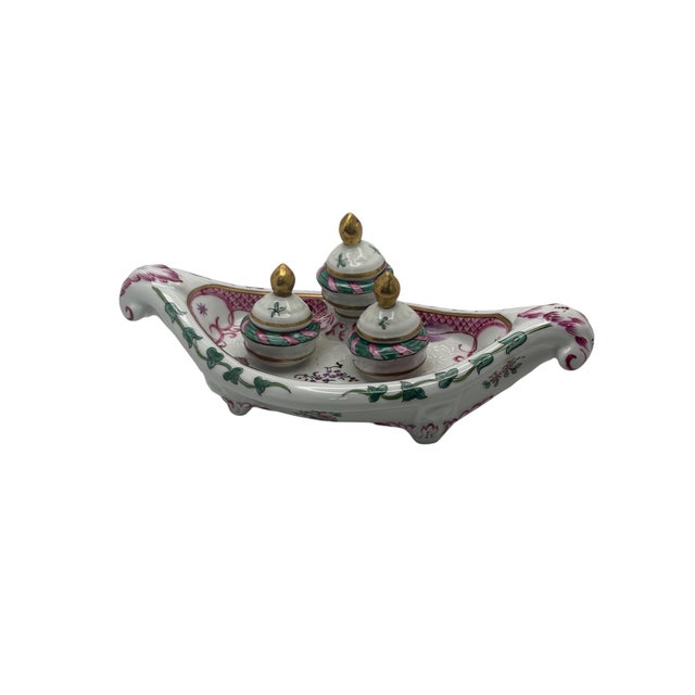 A vintage French Porcelaine De Paris gondola shaped, footed porcelain triple ink well by R. Bloch, ca. 1960’s. It has a...