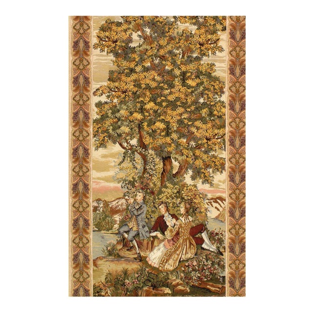Flemish wall tapestry was woven on a large scale from wool with muted earth tones into a lavish landscape composition that...