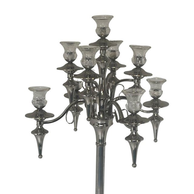 This is about as tall as they come! XXL candelabra made from chromed metal and glass coverings at the top. Has been used...