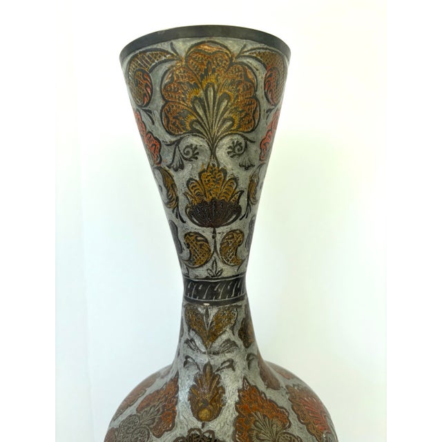 This striking vintage decorative vase was produced by Penco Industries Inc. and made in India, as confirmed by the...