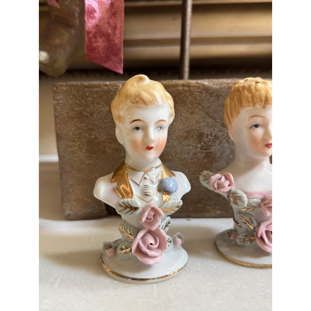 Charming vintage porcelain salt and pepper shakers depicting an elegantly dressed Victorian-style couple. This petite...