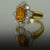 18K and platinum ring by Keith Davis set with one 3.98 carat orange sapphire and 24 round diamonds weighing 0.88 carats....