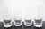 Tiffany & Co. set of 4 thin-walled crystal water glasses with a mid-century modern style acid-etched criss-cross or...