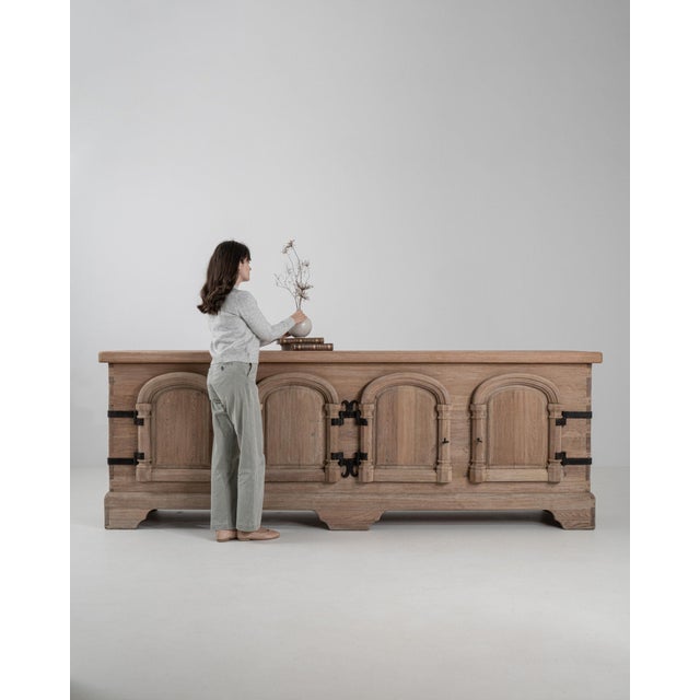 This chest of drawers carries genuine presence, its natural oak, black wrought iron scroll handle immediately setting the...