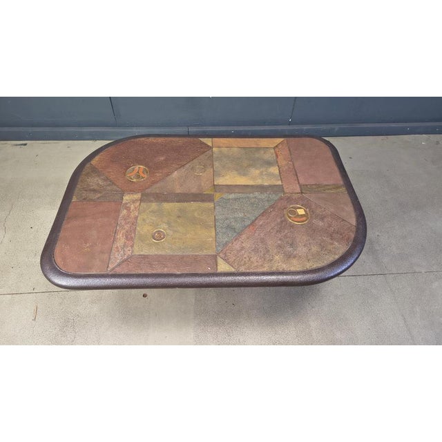 Brutalist slate and natural stone top coffee table with inlaid copper and brass. The base is also made from the same...