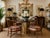 A beautiful set of four vintage Drexel dining chairs featuring carved faux bamboo frames in a wood finish. Designed in the...