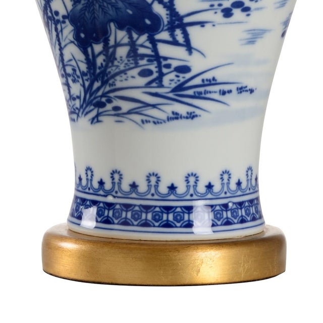 Blue And White Ceramic With Hand Painted Design On Antique Gold Leaf Mount. Clean with a dry cloth