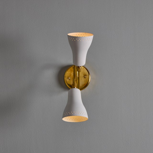 1950s Stilux Milano White Perforated Double Shade Wall Lamp&nbsp; An elegant midcentury sconce design executed in...