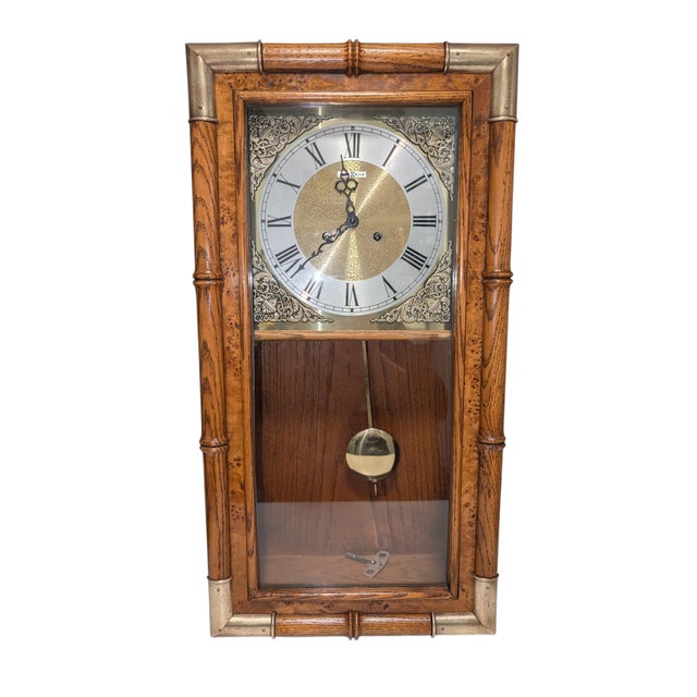 Timeless Elegance: 1970 Howard Miller "Faux Bamboo" Chiming Wall Clock ​Bring a touch of mid-century sophistication and...