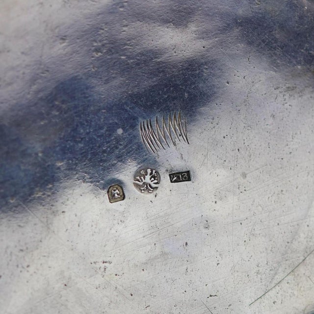 A monumental ceremonial Hanseatic beer tankard executed in chased and parcel-gilt silver, with a cylindrical body encased...