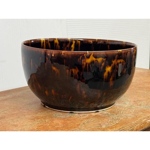Design Plus Gallery presents a Tortoiseshell Glaze Ceramic Bowl from Martino Interiors. The rounded form has a wide...