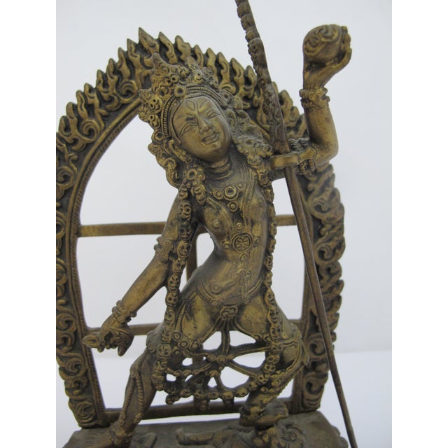 Exquisite brass statue depicting the Tibetan Buddhist deity Vajrayogini (or Vajradakini), a fierce tantric goddess...
