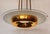 This round Art Deco chandelier, likely from the Petitot company, is made of solid brass and features a partially etched...