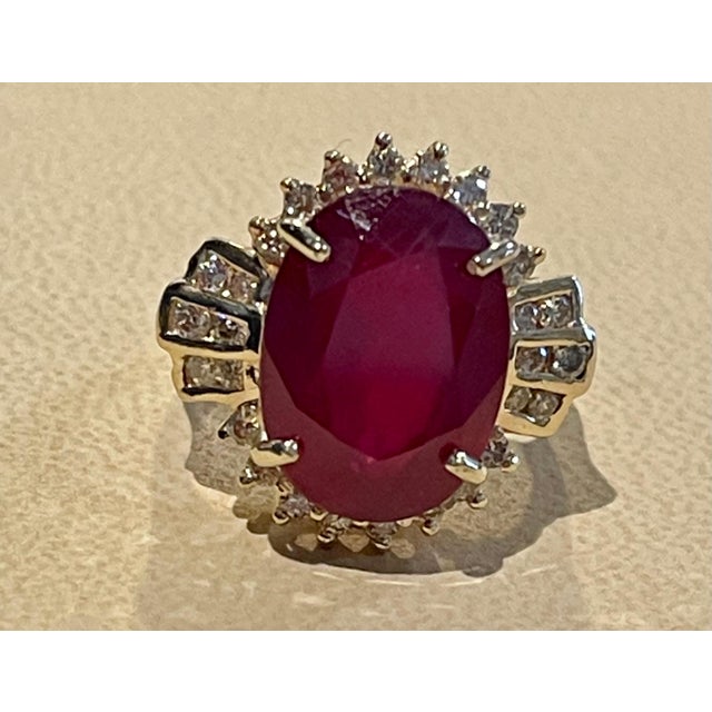 Oval 12 Carat Treated Ruby and 1 Carat Diamond 14 Karat Yellow Gold Ring For Sale In New York - Image 6 of 18
