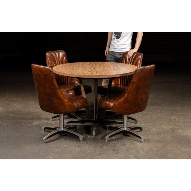 c. 1960s/1970s; Chromcraft Inc. - Senatobia, MS Five-piece drop-leaf dinette set with sculpted woodgrain laminate top and...