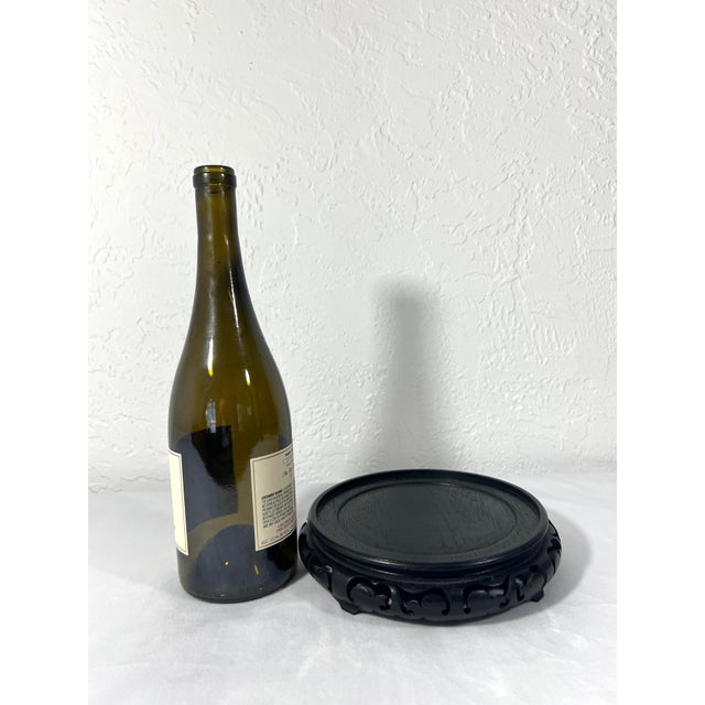 Large vintage Chinese rosewood stand, hand carved in great detail around the edges with a raised turned top for the...