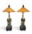 A pair of vintage Frederick Cooper lamps. Featuring three whimsical ceramic frogs with a sculptural base, each foot ending...
