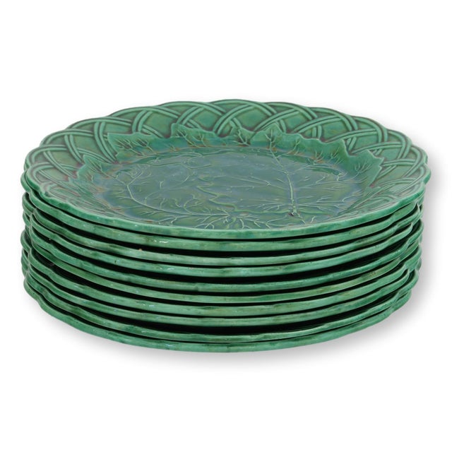 Late 19th century English majolica plates in an elegant leaf and basketweave pattern, offered as a rare set of ten. Richly...