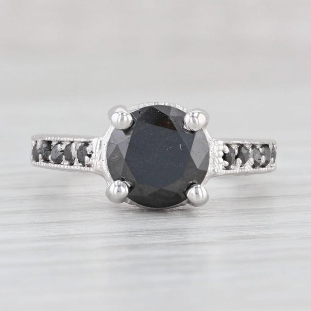 Gemstone Information: - Natural Diamonds - Total Carats - 2.70ctw (2.50ct center, 0.20ctw Accents) Cut - Round Brilliant...