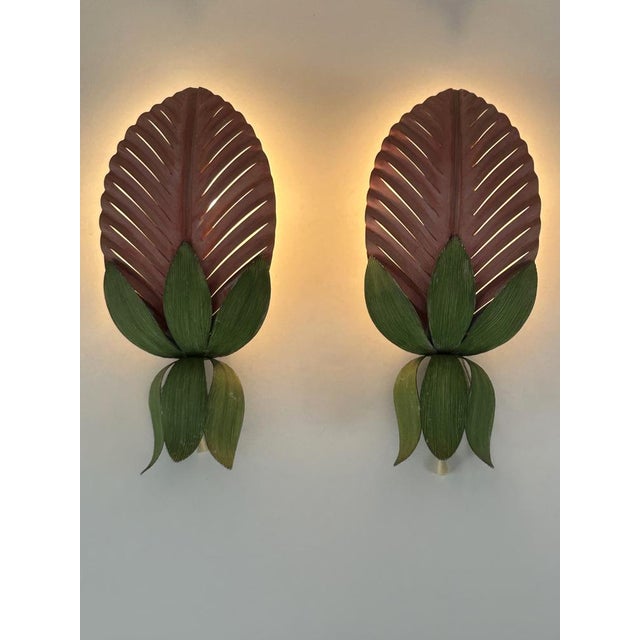 Set of two rare and highly decorative mid-century modern floral sconces or wall fixtures. Designed and hand-made by...