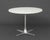 Mid-Century Modern White Laminate Circular Top Steel Center Table, the metal stem above a four-pointed star base. 29" H x...